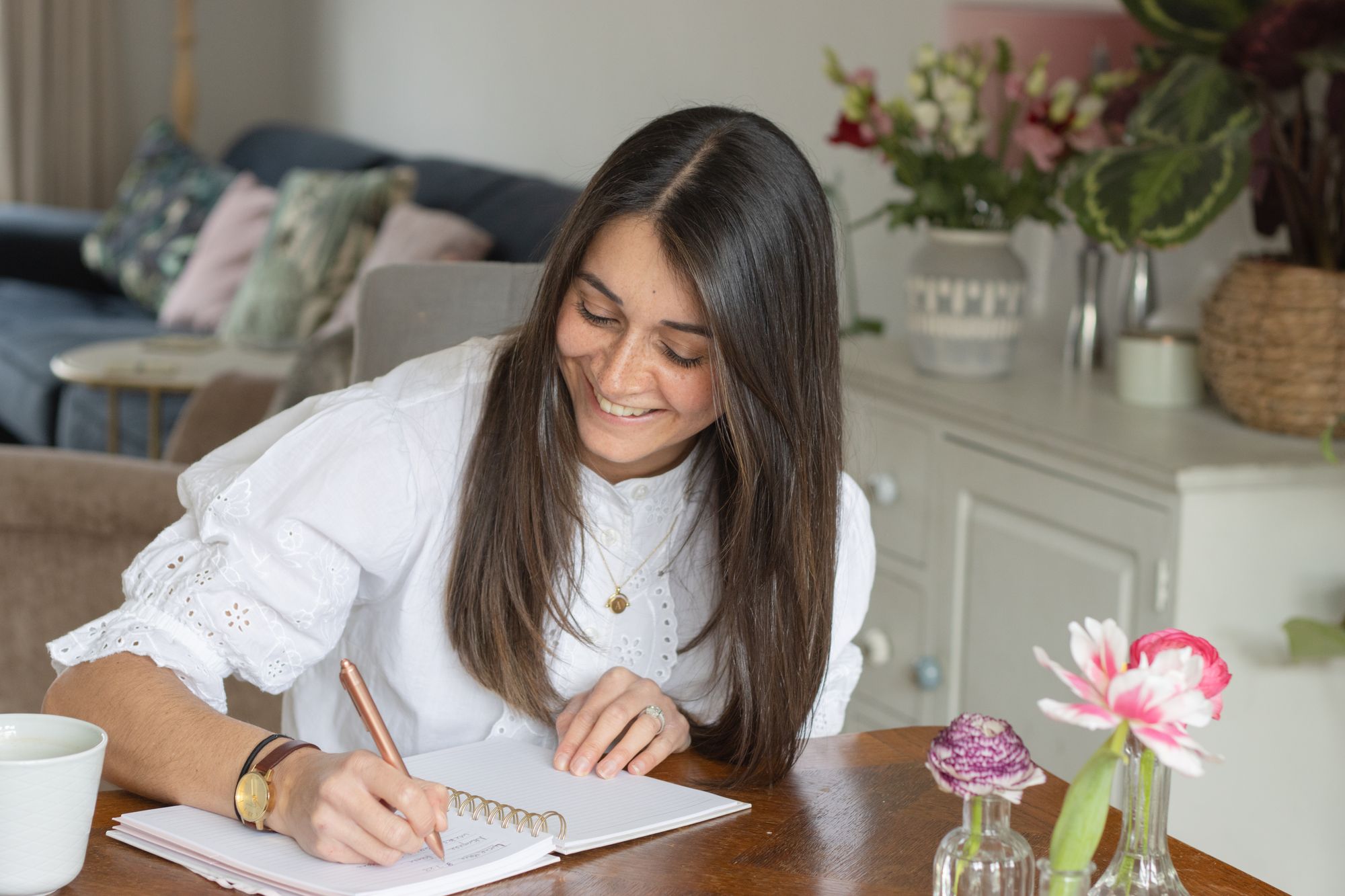 Relaxed headshot photo with notebook of Apple Blossom Flowers at home in Berkhamsted by Tanya Aldcroft Photography
