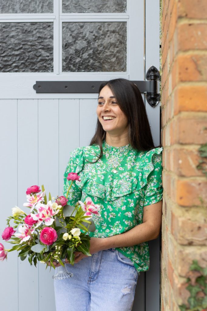 Relaxed headshot photo of florist Apple Blossom Flowers with bouquet in Berkhamsted by Tanya Aldcroft Photography