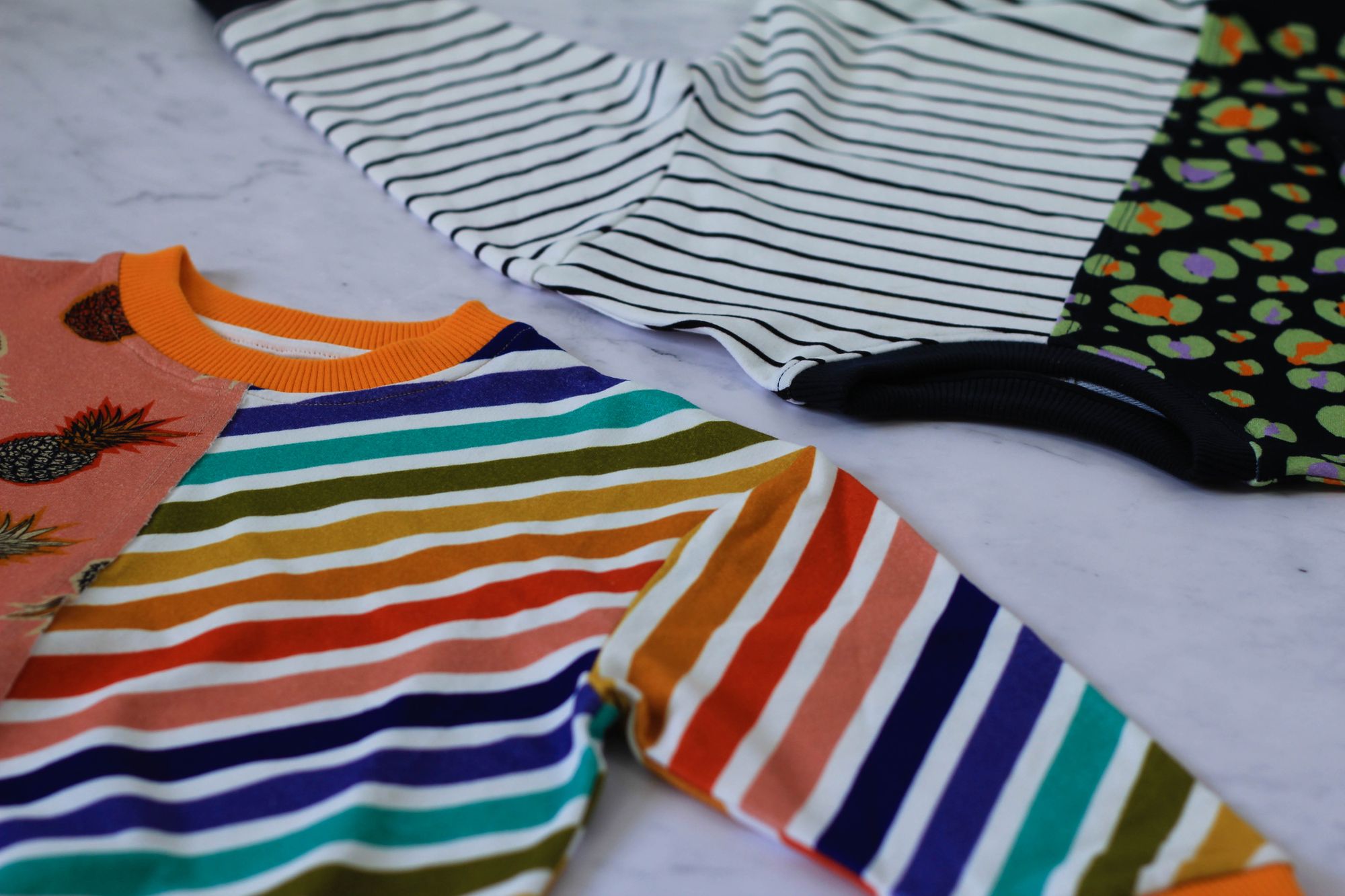 Product photography of two striped sweaters designed by Wilder Ones by Tanya Aldcroft Photography