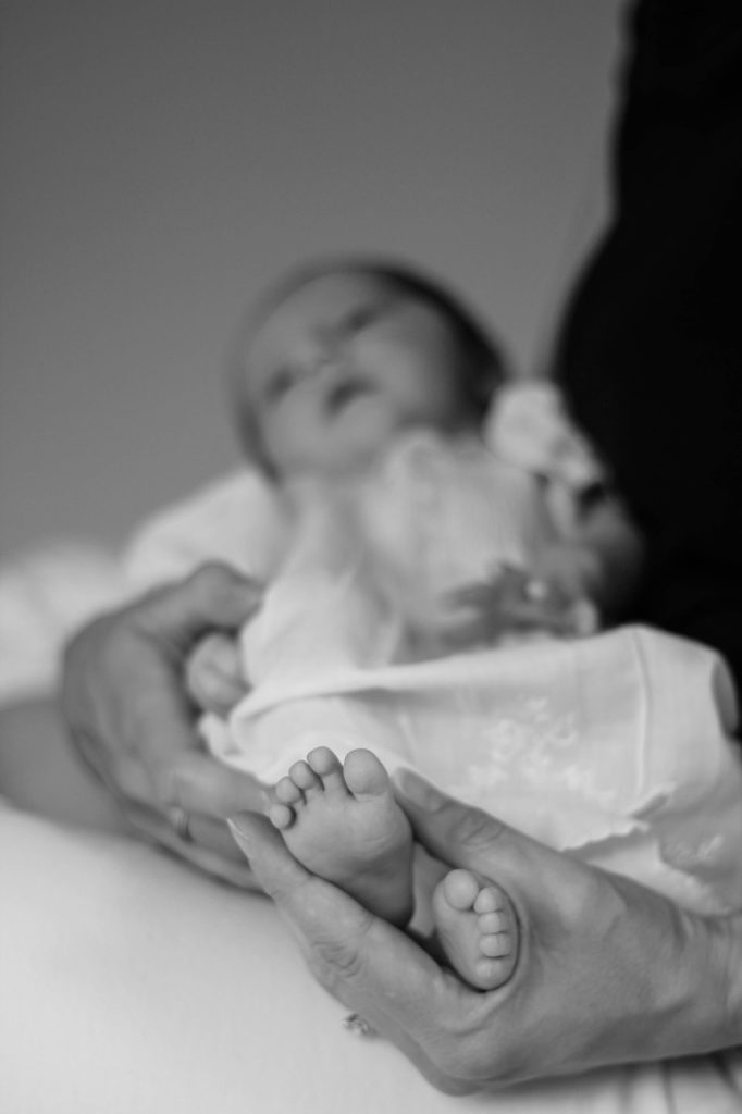 Photo of newborn baby girl feet from an at home photo shoot by Tanya Aldcroft Photography