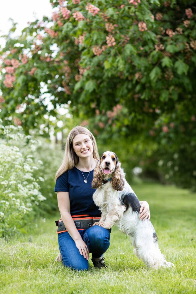 Relaxed branding headshot of Jo from Ravenpaws Training and Behaviour with her dog during a photo shoot in Cheddington, Buckinghamshire by Aldcroft Photography