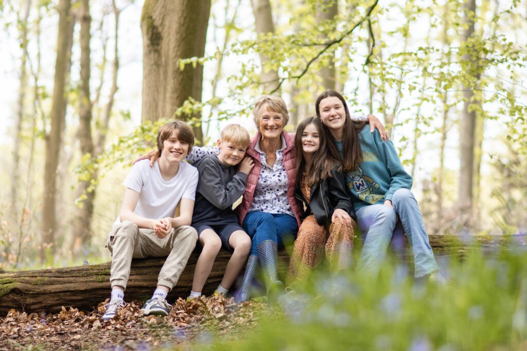 Grandmother with teenage grandchildren on a photo shoot in the woods, Buckinghamshire by Aldcroft Photography