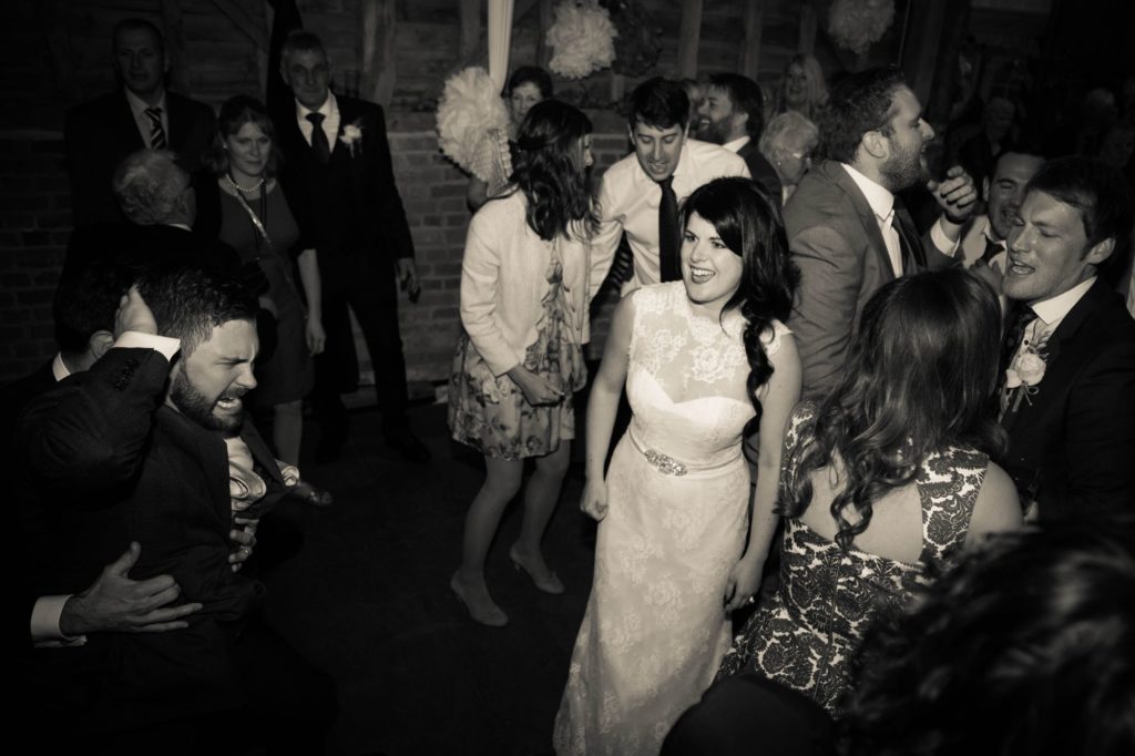 Photo of bride and guests dancing at wedding recpetion by Tanya Aldcroft Photography