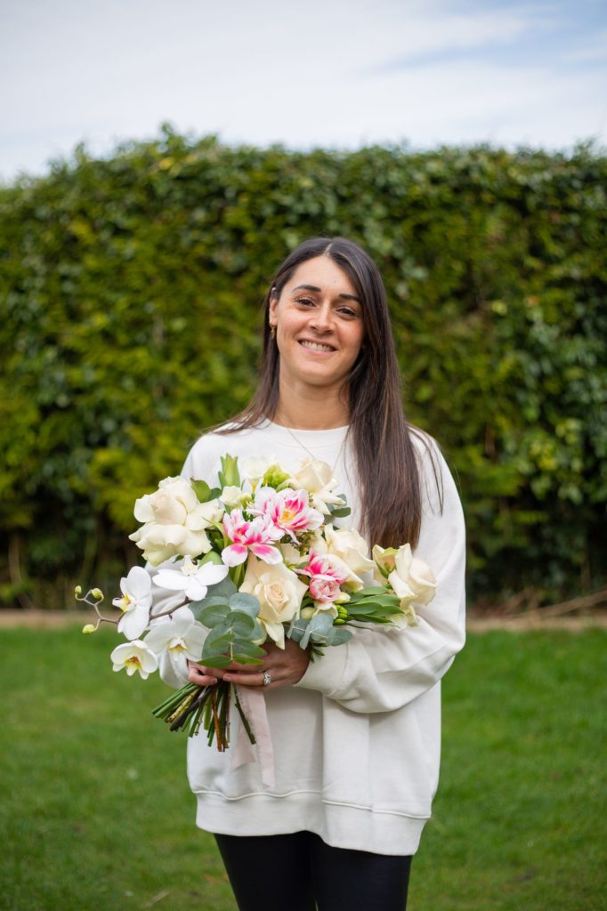 Relaxed headshot photo of florist Apple Blossom Flowers with bouquet in Berkhamsted by Tanya Aldcroft Photography