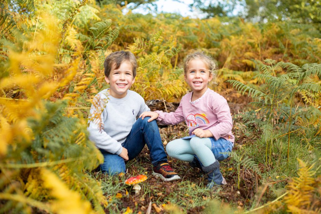 Brother and sister at an autumn family photo shoot at Ashridge near Berkhamsted in Hertfordshire
