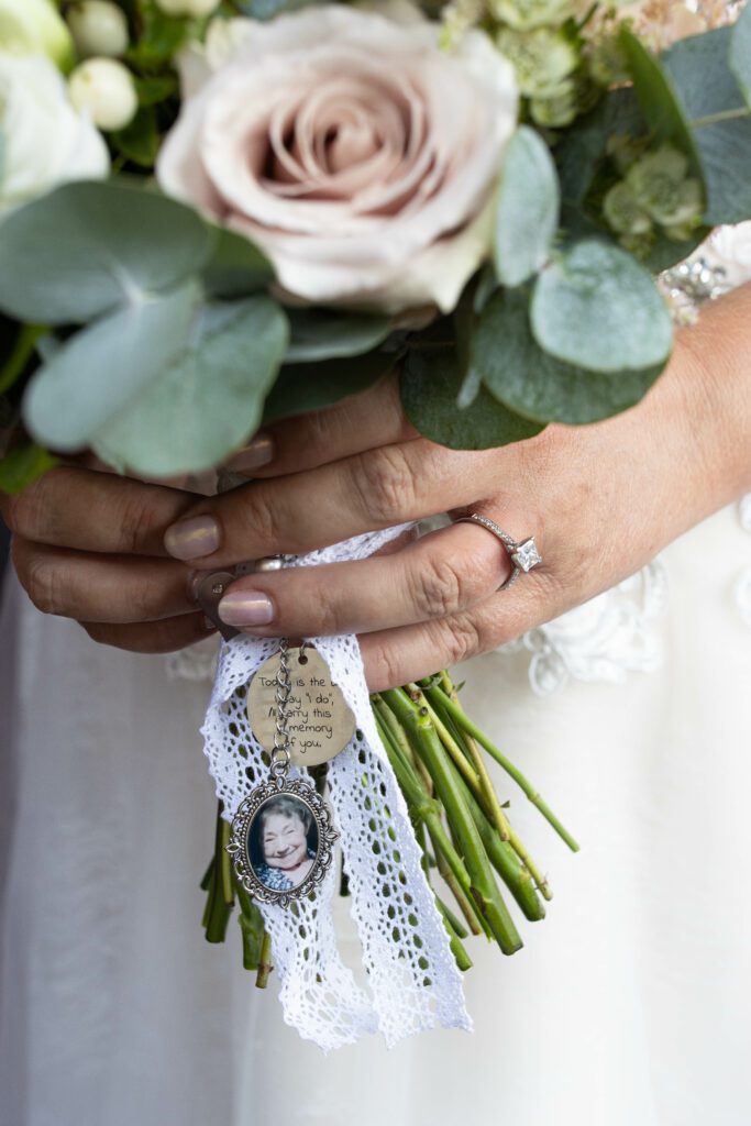 Wedding bridal bouquet detail with engagement ring, Fanhams Hall, Ware, Hertfordshire 